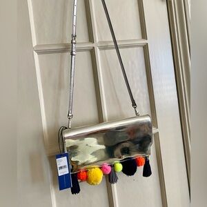 Rebecca Minkoff silver metallic crossbody handbag. NEW NWT. Pom Poms! Sofia